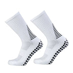 Paire de chaussettes de foot antidérapantes blanches, picots silicone noirs sous la semelle